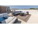 Relax on the roof deck featuring stylish outdoor seating and a cozy fire pit table, perfect for entertaining at 2750 Reserve Ct # 101, Dunedin, FL 34698