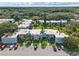 Aerial view showcasing a community with lush landscaping, well-maintained buildings, and ample parking at 2840 Somerset Park Dr # 203, Tampa, FL 33613