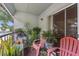 Inviting balcony featuring ample seating, vibrant plants, and natural light at 2840 Somerset Park Dr # 203, Tampa, FL 33613