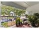 Relaxing balcony with lush greenery and serene neighborhood views at 2840 Somerset Park Dr # 203, Tampa, FL 33613