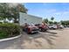 Exterior view of a modern condo building with well-maintained landscaping and reserved parking spaces at 2840 Somerset Park Dr # 203, Tampa, FL 33613