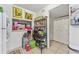 Bright kitchen with a pass-through window to the living area and ample storage at 2840 Somerset Park Dr # 203, Tampa, FL 33613