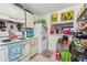 White kitchen area with ample storage and view through to the living room at 2840 Somerset Park Dr # 203, Tampa, FL 33613