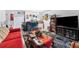 Cozy living room featuring a decorative rug, comfy seating, and a large TV at 2840 Somerset Park Dr # 203, Tampa, FL 33613