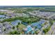 Overhead shot of a community's amenities including pool, tennis, and basketball courts, creating recreational opportunities at 30140 Barnaby Ln, Wesley Chapel, FL 33543
