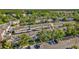 A neighborhood view with neat townhomes, mature trees, and ample parking space, blending comfort and convenience at 30140 Barnaby Ln, Wesley Chapel, FL 33543