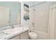 Clean bathroom features a shower, tub, a vanity with sink, and towel rack at 30140 Barnaby Ln, Wesley Chapel, FL 33543