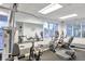 Bright gym with multiple exercise bikes, elliptical and weight machines at 30140 Barnaby Ln, Wesley Chapel, FL 33543