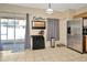 Spacious kitchen area with stainless steel appliances, ample counter space, and sliding glass doors at 30140 Barnaby Ln, Wesley Chapel, FL 33543