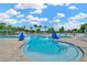Inviting community pool with easy-access stairs and comfortable lounge chairs at 30140 Barnaby Ln, Wesley Chapel, FL 33543