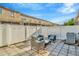 Outdoor patio includes outdoor seating and a white privacy fence at 30140 Barnaby Ln, Wesley Chapel, FL 33543