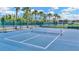 Aerial view of a new tennis court showing crisp lines and vibrant colors at 30140 Barnaby Ln, Wesley Chapel, FL 33543