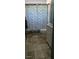 Tidy bathroom with a vanity, toilet, and shower with decorative curtain at 3026 19Th Sw Pl, Largo, FL 33774