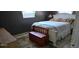 Comfortable bedroom with a neutral color scheme, and a decorative trunk at 3026 19Th Sw Pl, Largo, FL 33774