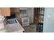 Functional kitchen with white appliances, ample counter space, and wood cabinetry at 3026 19Th Sw Pl, Largo, FL 33774