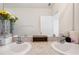 Bright bathroom featuring a double sink vanity with ample counter space, and a large mirror at 32965 Kaloko Rd, Wesley Chapel, FL 33543