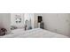 Bedroom featuring a window, closet, and shelving offering practical functionality at 32965 Kaloko Rd, Wesley Chapel, FL 33543
