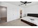 Bright bedroom featuring carpeted floors, white walls, and a ceiling fan for added comfort at 32965 Kaloko Rd, Wesley Chapel, FL 33543