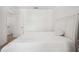 Bedroom with white walls, a queen-size bed, and a walk-in closet for ample storage at 32965 Kaloko Rd, Wesley Chapel, FL 33543