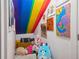Small bedroom or closet with colorful artwork and decorations at 32965 Kaloko Rd, Wesley Chapel, FL 33543