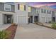 Contemporary townhome with well-maintained landscaping, neutral paint, and a private garage at 32965 Kaloko Rd, Wesley Chapel, FL 33543