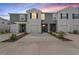 Contemporary townhome with well-maintained landscaping, neutral paint, and a private garage at 32965 Kaloko Rd, Wesley Chapel, FL 33543
