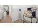 Bright hallway with modern decor, featuring stylish organizers and neutral tones at 32965 Kaloko Rd, Wesley Chapel, FL 33543