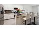 Stylish kitchen island with granite countertops, stainless appliances, and white cabinetry at 32965 Kaloko Rd, Wesley Chapel, FL 33543