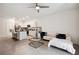 Open-concept living room flows into a modern kitchen with granite countertops and island seating at 32965 Kaloko Rd, Wesley Chapel, FL 33543