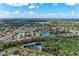 High aerial view showcases a well-planned residential neighborhood with ponds and lush greenery at 3330 46Th E Ter, Bradenton, FL 34203