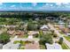 Neighborhood aerial view of homes, streets and landscaping featuring a scenic pond at 3330 46Th E Ter, Bradenton, FL 34203