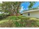 Large, grassy backyard featuring mature trees and a fenced perimeter, perfect for privacy at 3330 46Th E Ter, Bradenton, FL 34203