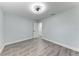 Fresh bedroom design with light blue-gray walls, and modern ceiling fan at 3330 46Th E Ter, Bradenton, FL 34203