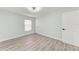 Bright bedroom with wood-look floors, ceiling fan and light blue-gray walls at 3330 46Th E Ter, Bradenton, FL 34203