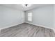 Comfortable bedroom with light blue walls, window, and modern ceiling fan at 3330 46Th E Ter, Bradenton, FL 34203