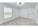 Stylish bedroom featuring wood-look floors, light-colored walls, and a ceiling fan at 3330 46Th E Ter, Bradenton, FL 34203