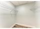 Walk-in closet with wire shelves and wood-look flooring at 3330 46Th E Ter, Bradenton, FL 34203