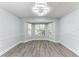 Bright dining room featuring a bay window, modern light fixture, and wood-look flooring at 3330 46Th E Ter, Bradenton, FL 34203