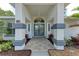Front entrance boasting an arched entryway, tiled floor, and tastefully designed columns at 3330 46Th E Ter, Bradenton, FL 34203