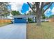Charming single-story home featuring a driveway, manicured landscaping, and a well-maintained lawn at 3330 46Th E Ter, Bradenton, FL 34203