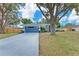 Charming single-story home featuring a driveway, landscaping, and a well-maintained lawn at 3330 46Th E Ter, Bradenton, FL 34203