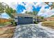 Attached two car garage with driveway and well manicured front yard and landscaping at 3330 46Th E Ter, Bradenton, FL 34203
