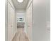 Hallway with closet doors leading to a modern bathroom at 3330 46Th E Ter, Bradenton, FL 34203