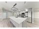 Modern kitchen with a large island and stainless steel appliances at 3330 46Th E Ter, Bradenton, FL 34203