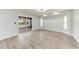 Bright living room with sliding doors to screened patio and wood-look flooring at 3330 46Th E Ter, Bradenton, FL 34203