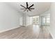 Spacious living room featuring new wood-look floors and neutral paint tones at 3330 46Th E Ter, Bradenton, FL 34203