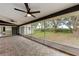 Relax in this screened patio with ceiling fans and views of the backyard at 3330 46Th E Ter, Bradenton, FL 34203