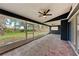 Enjoy this tiled screened patio with ceiling fans, perfect for outdoor entertaining and relaxation at 3330 46Th E Ter, Bradenton, FL 34203