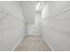 Walk-in closet featuring wire shelving for easy storage and organization at 35609 Stableton Lane, Zephyrhills, FL 33541