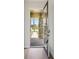 Inviting entryway with a view of the stone-accented exterior and a paved walkway at 35609 Stableton Lane, Zephyrhills, FL 33541